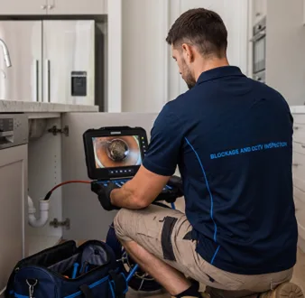 Clearing a blocked sink at a Green Valley property